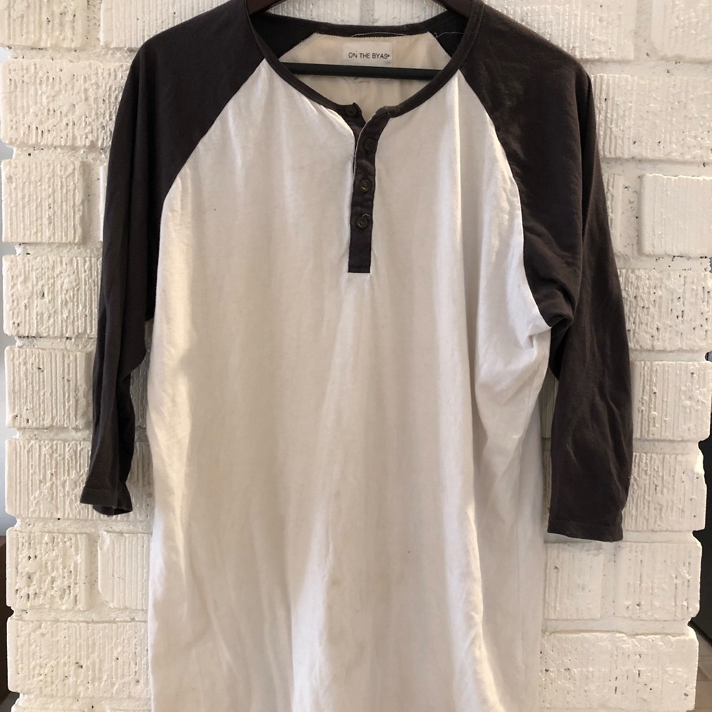 On the Byas 3/4 sleeve Henley shirt entended length